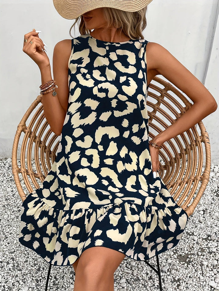 Vestito elegante con stampa leopardata e dettaglio sulla schiena