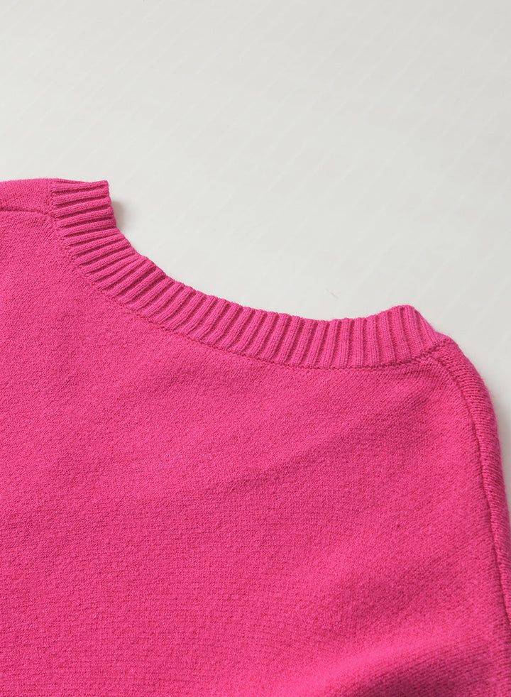 Solène – Pull rose avec col en V et détails en forme de cœur