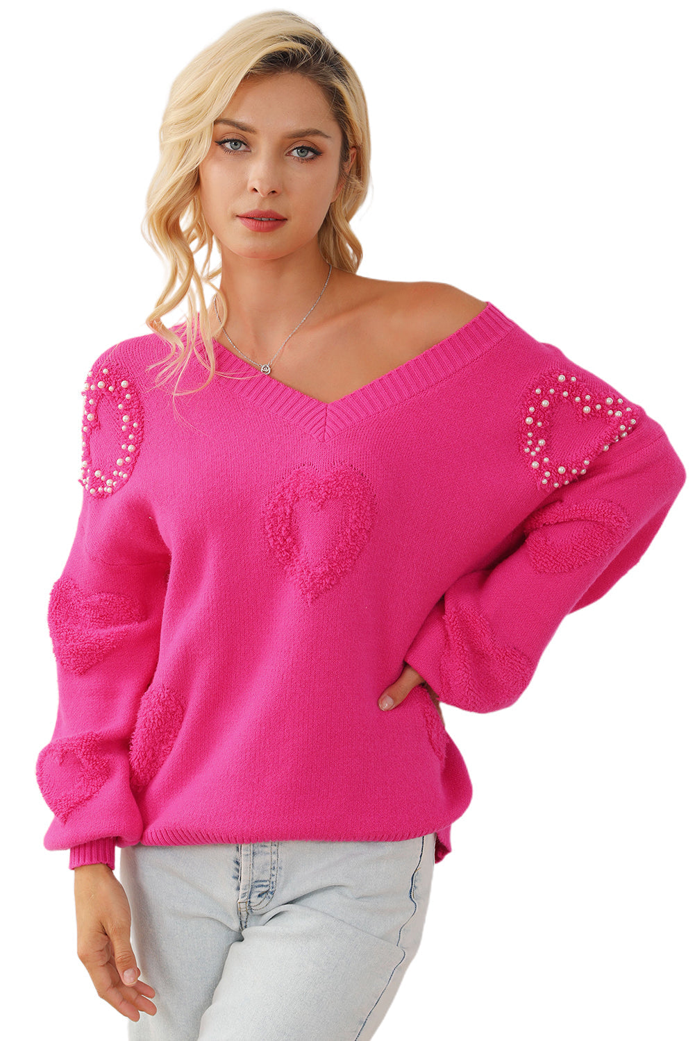 Solène – Pull rose avec col en V et détails en forme de cœur