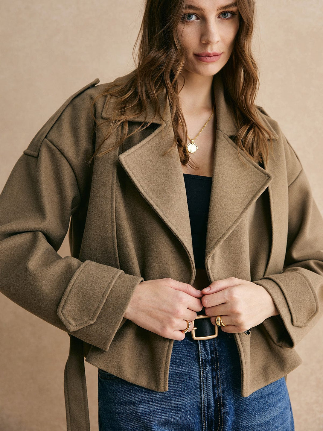 Veste chaude avec ceinture unie.