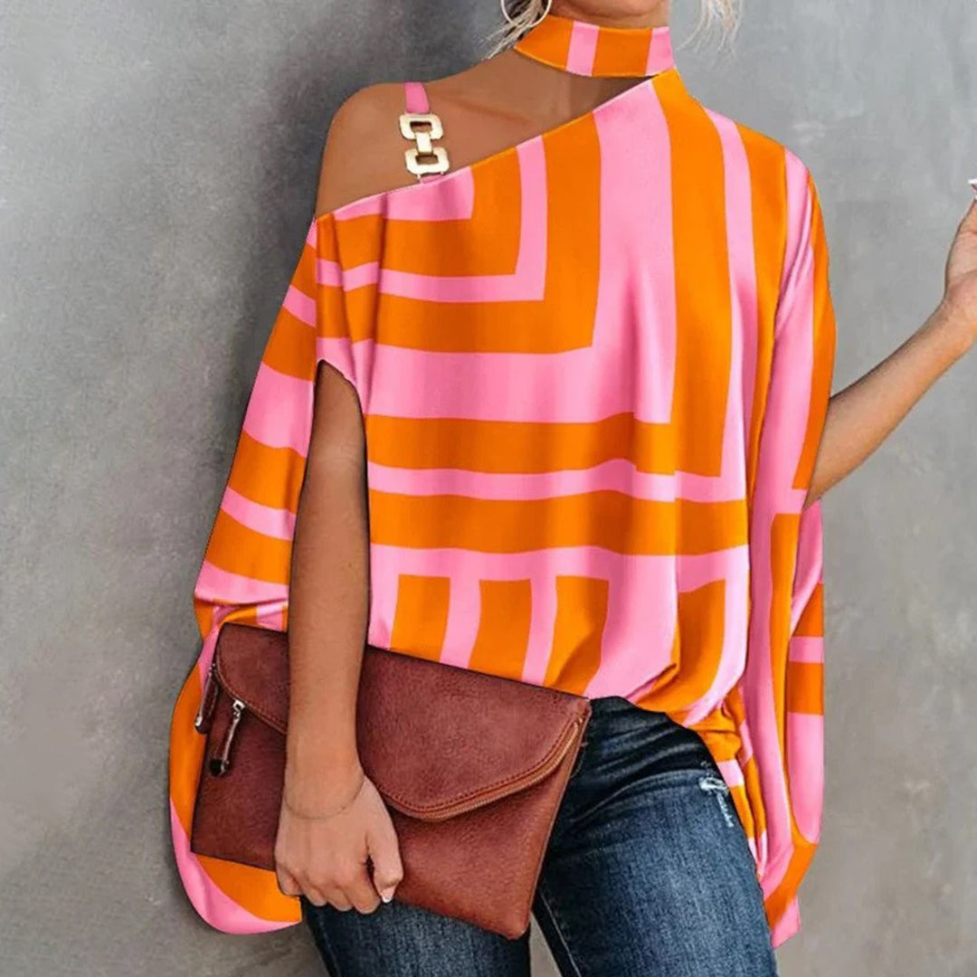 Top asymétrique femme chic – Imprimé géométrique, épaules dénudées avec détail chaîne dorée