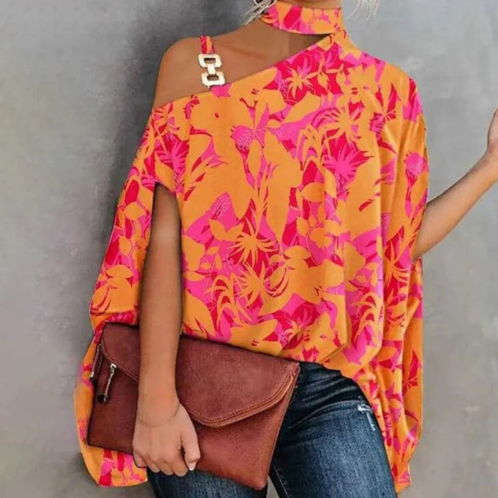 Top asymétrique femme chic – Imprimé géométrique, épaules dénudées avec détail chaîne dorée