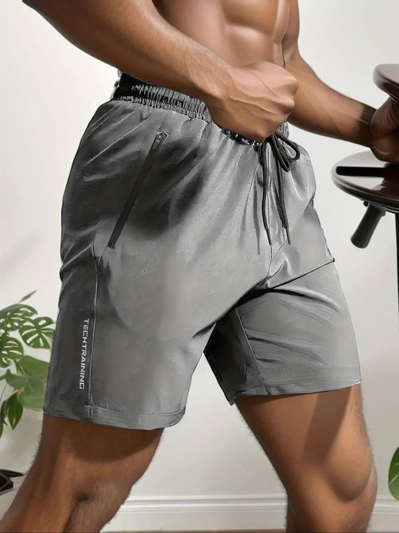 Short de sport homme TechTraining – Léger, respirant, séchage rapide avec poches zippées