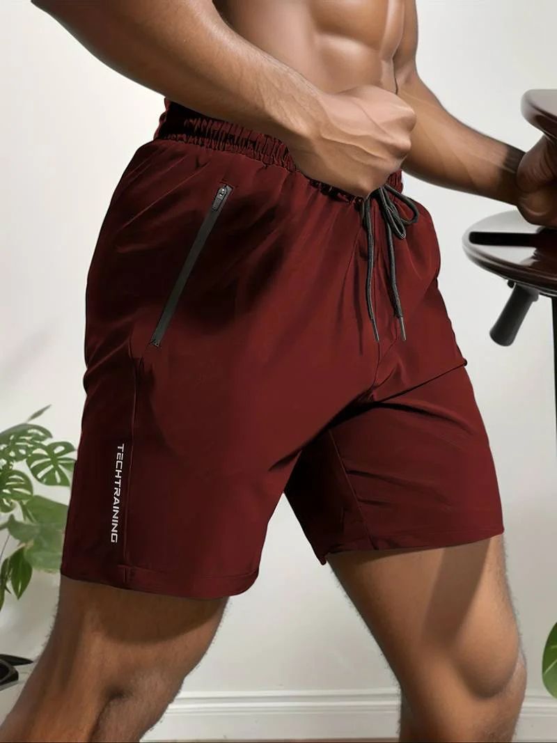 Short de sport homme TechTraining – Léger, respirant, séchage rapide avec poches zippées