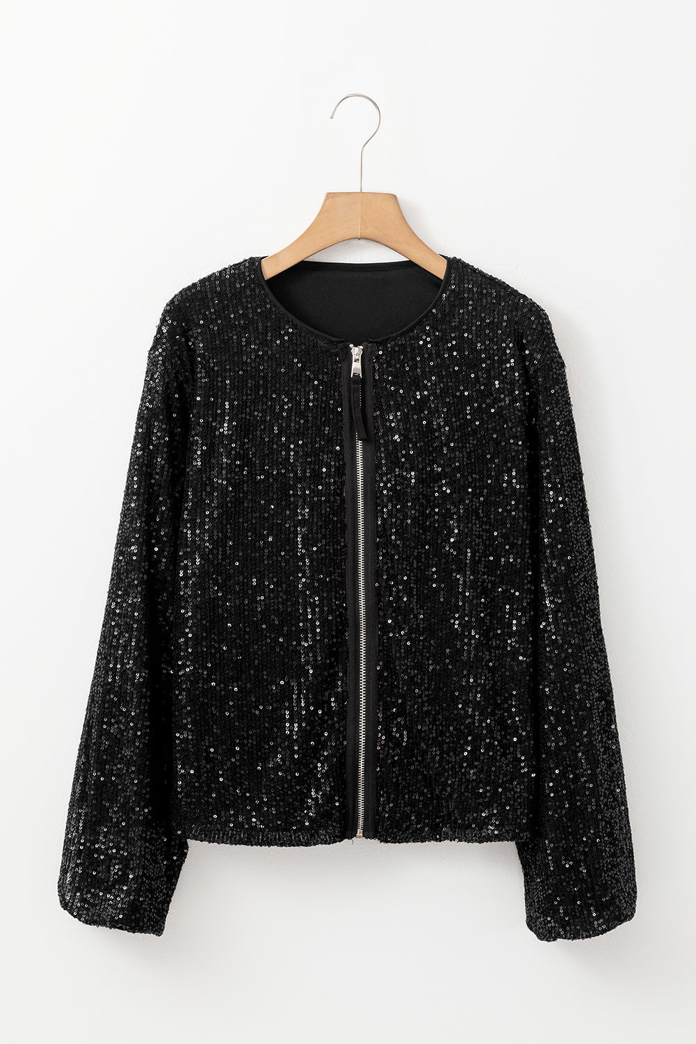 Clémence – Veste noire à paillettes avec col rond et manches longues